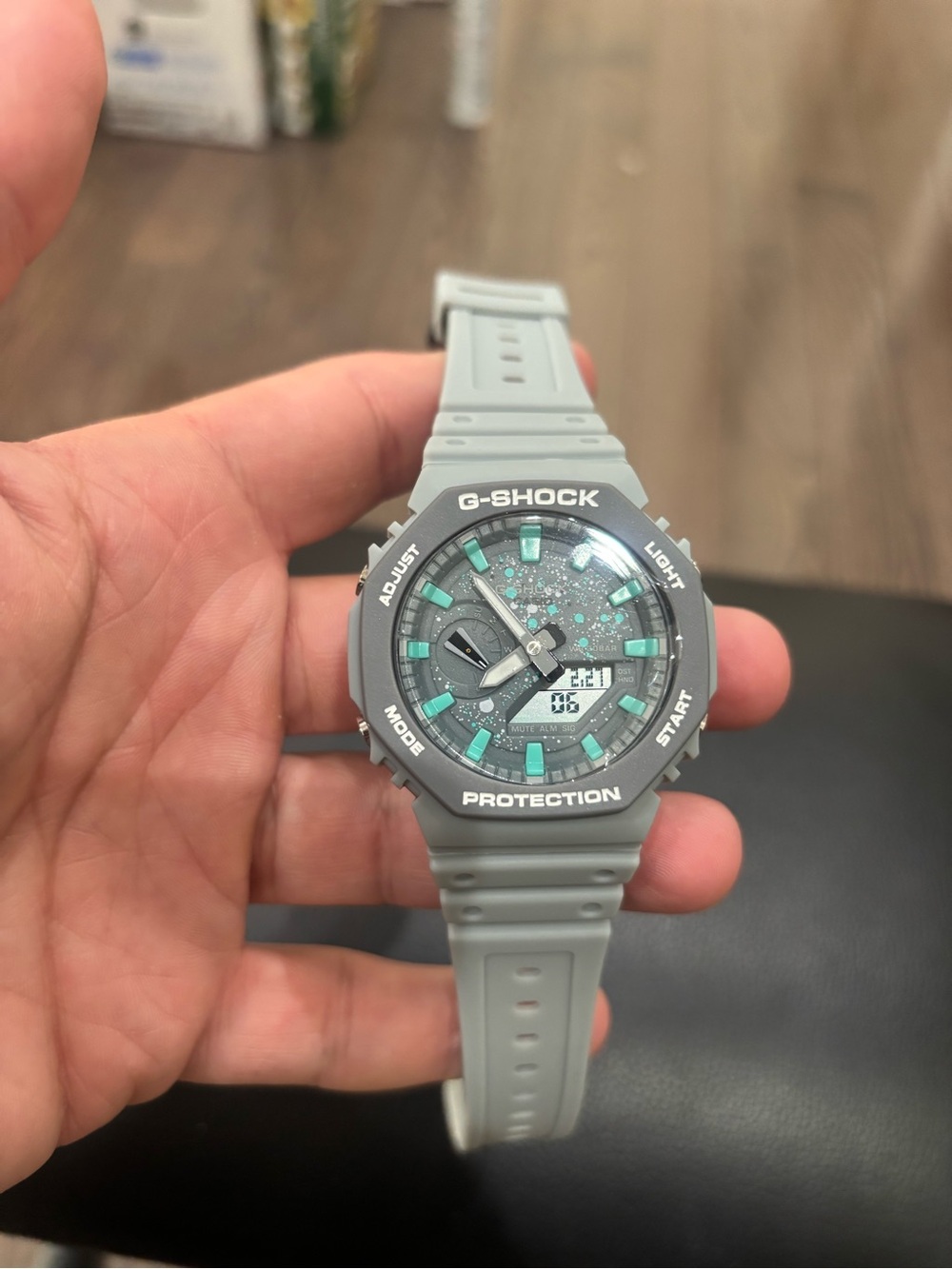 G-Shock Gray Resin Watch with Teal Accents
